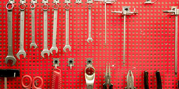 Red Pegboard for Tool Storage in the Garage