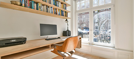 Spacious Home Office With Large Wooden Desk and Bookshelves