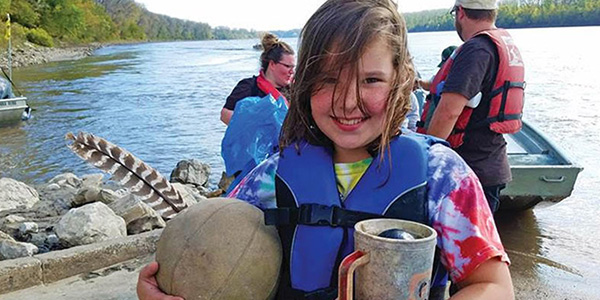 Girl Cleaning Up On Coastal Cleanup Day