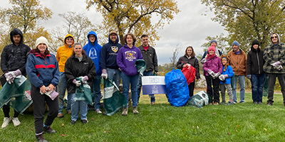 Open Space STL Volunteers With Trash From Cleanup