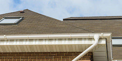 White Gutter Against Brown Roof