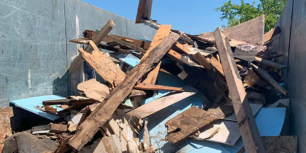 Dumpster Half-FIlled With Debris