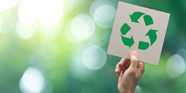 Recycling Sign on Green Background