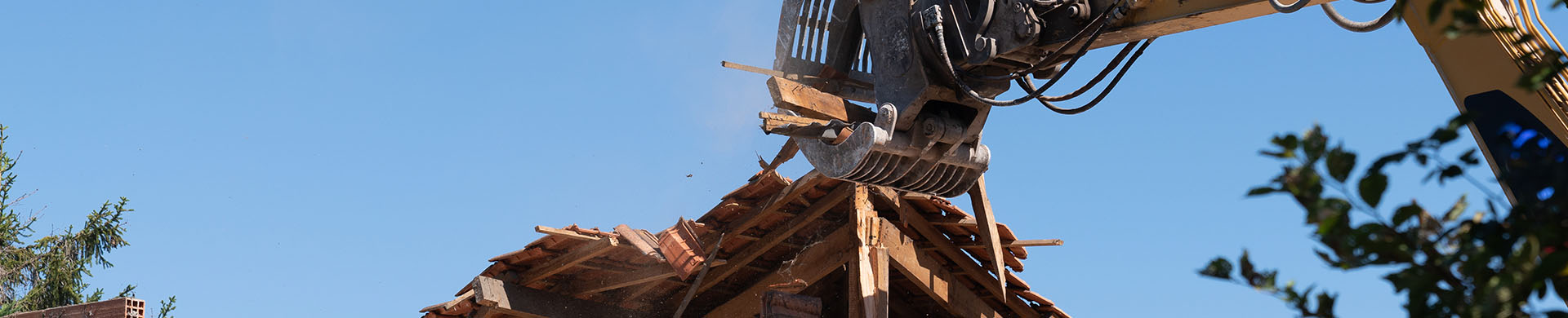 Partially Deconstructed Home With Crane