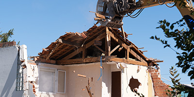 Partially Deconstructed Home With Crane