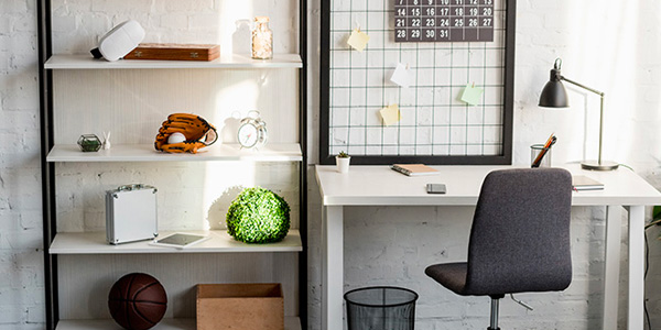 Office Desk and Shelving With Knickknacks
