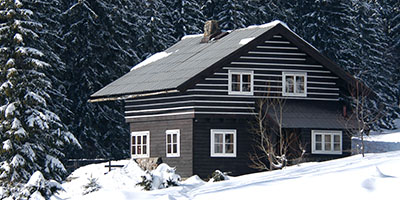 Home Covered in Snow Winter Preparation