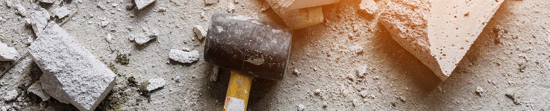 Broken Concrete Pieces With Hammer
