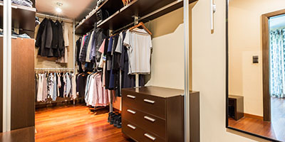 Walk-In Closet With Wooden Wardrobes