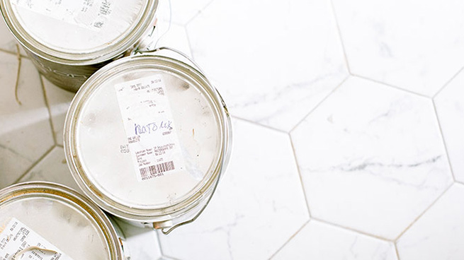 Old Paint Cans on White Tile Floor