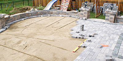 Paver Patio Being Installed in Backyard