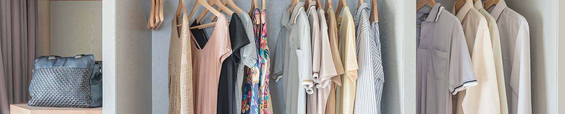 Organized Closet With Shirts Hanging on Hangers