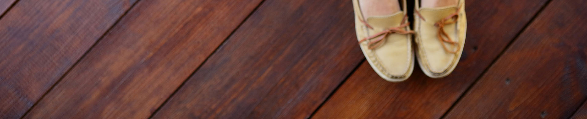 Woman Sitting On Finished Hardwood Floor