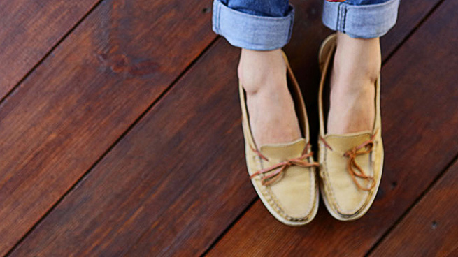 Woman Sitting on Hardwood Floor With Coffee