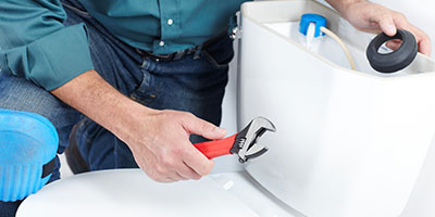 Person Installing a Toilet