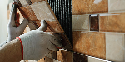 Person Installing Bathroom Tile