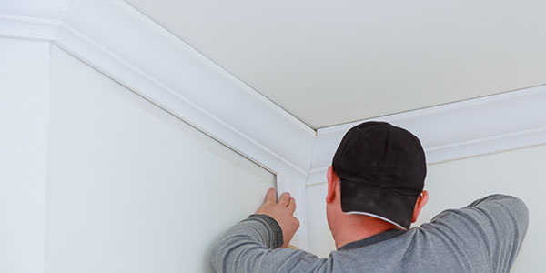 Man Installing Crown Molding