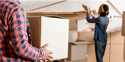 Couple Packing Up Boxes to Move