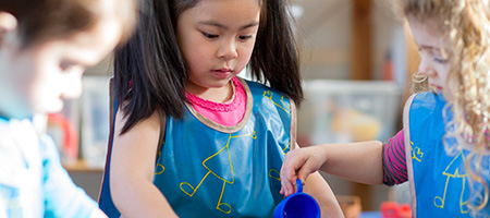 Kids playing at water table