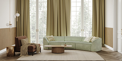 Green Couch and Green Curtains in High-Ceilinged Living Room