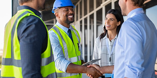 Couple Meeting With Two Contractors