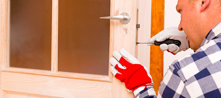 Man Fixing Exterior Door