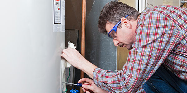 Hot Water Heater Being Examined by Repairman