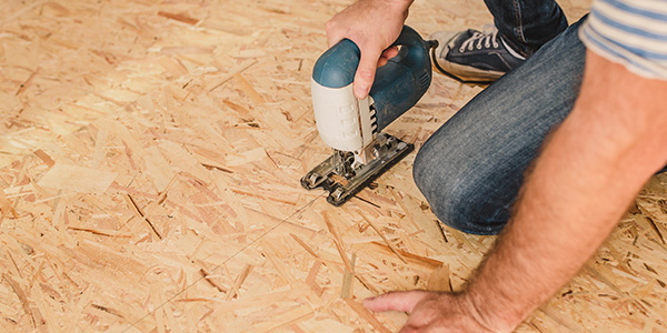 Man Installing OSB Subfloor