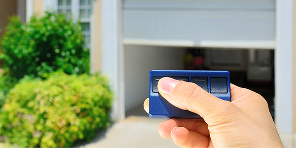 Man Operating Garage Door Opener