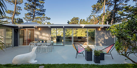 Exterior View of a Mid-Century Modern Style House With a Combination of Wood and Glass Elements.
