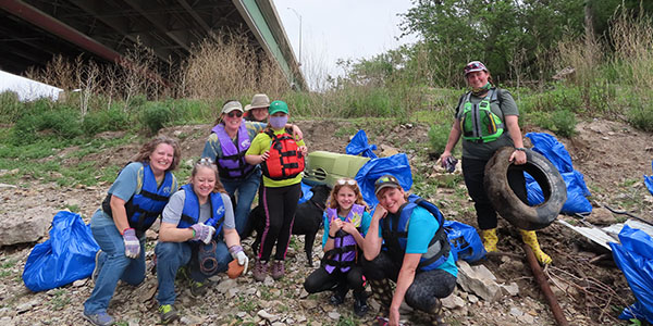 Volunteers Pose With Trash Bags