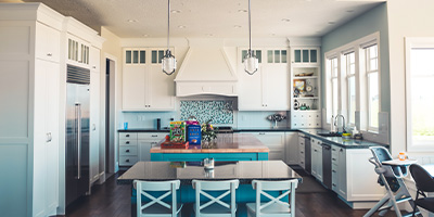 White Kitchen And Dining Room With Open Floor Plan