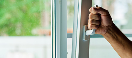 Man's Hand Opening Window