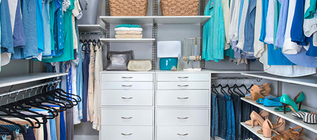 Organized Walk-In Closet With Drawers and Clothing Rods