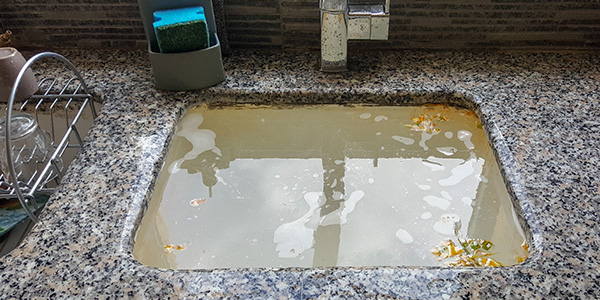 Overflowing Kitchen Sink With Clogged Drains