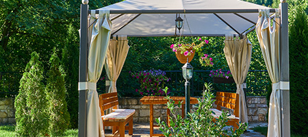 Backyard Pergola With Curtains Drawn