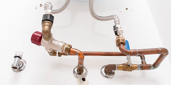Hot and Cold Water Pipes Under Hot Water Heater