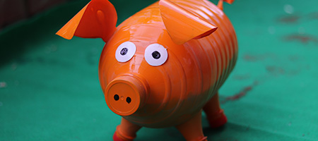 Orange DIY Piggy Bank Made From Plastic Bottle