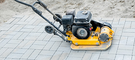 Plate Compactor On Top of New Paver Patio