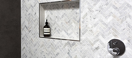 Porcelain Tile in Chevron Pattern on Shower Wall