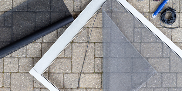 Porch Screen Materials Laid Out on Stone Patio