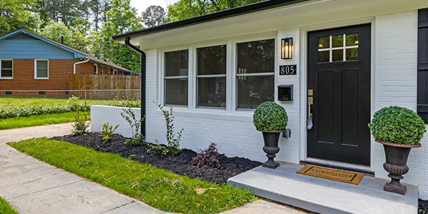 Ranch Style Home with Potted Plants