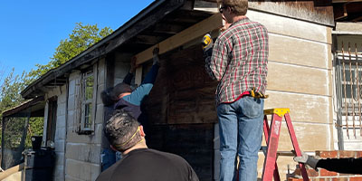 Group of People Constructing a Building