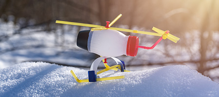 Plastic Bottle Airplane Sitting in Snow