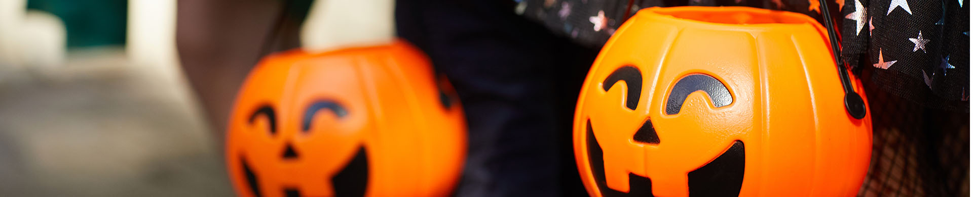 Kids Holding Pumpkin Trick or Treat Baskets on Halloween