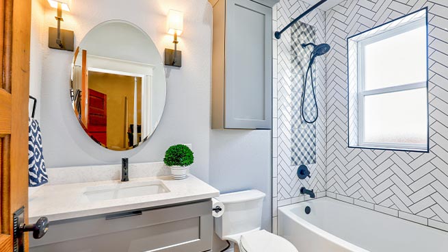 White Bathroom With Mirror, Vanity and Tub