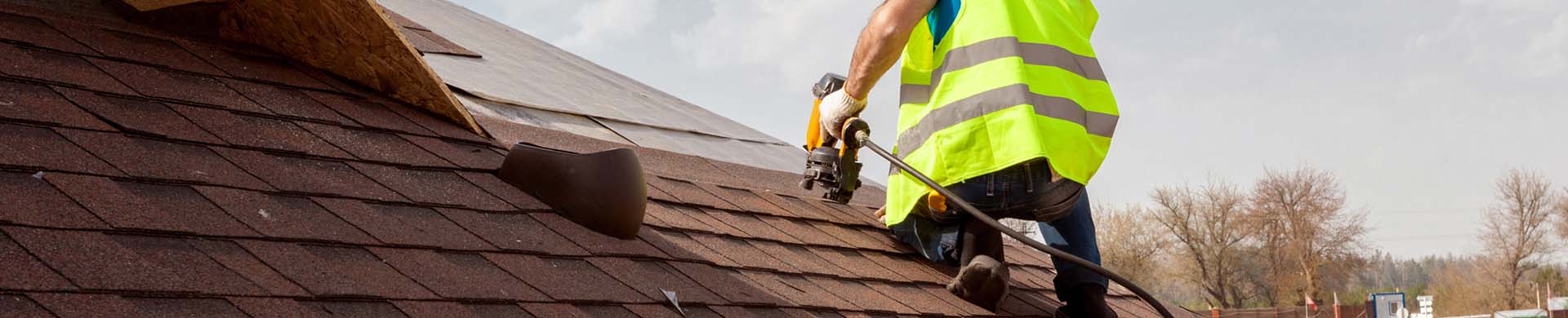 Person Inspecting Roof for Damage