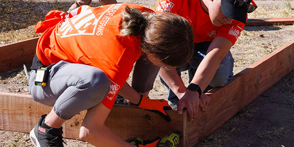 Two Volunteers Building Frame