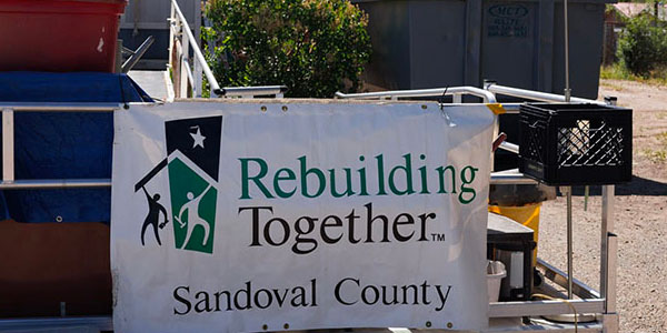 Dumpster With Rebuilding Together Sandoval County Sign