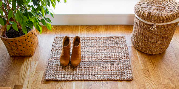 Jute Doormat On Hardwood Floor In Front Of Window